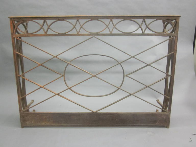 Elegant French hand-hammered wrought iron console in the modern neoclassical tradition with intersecting diamond form and X-form designs. The piece is typical of the French Napoleon III period which was a strong influence on the great French