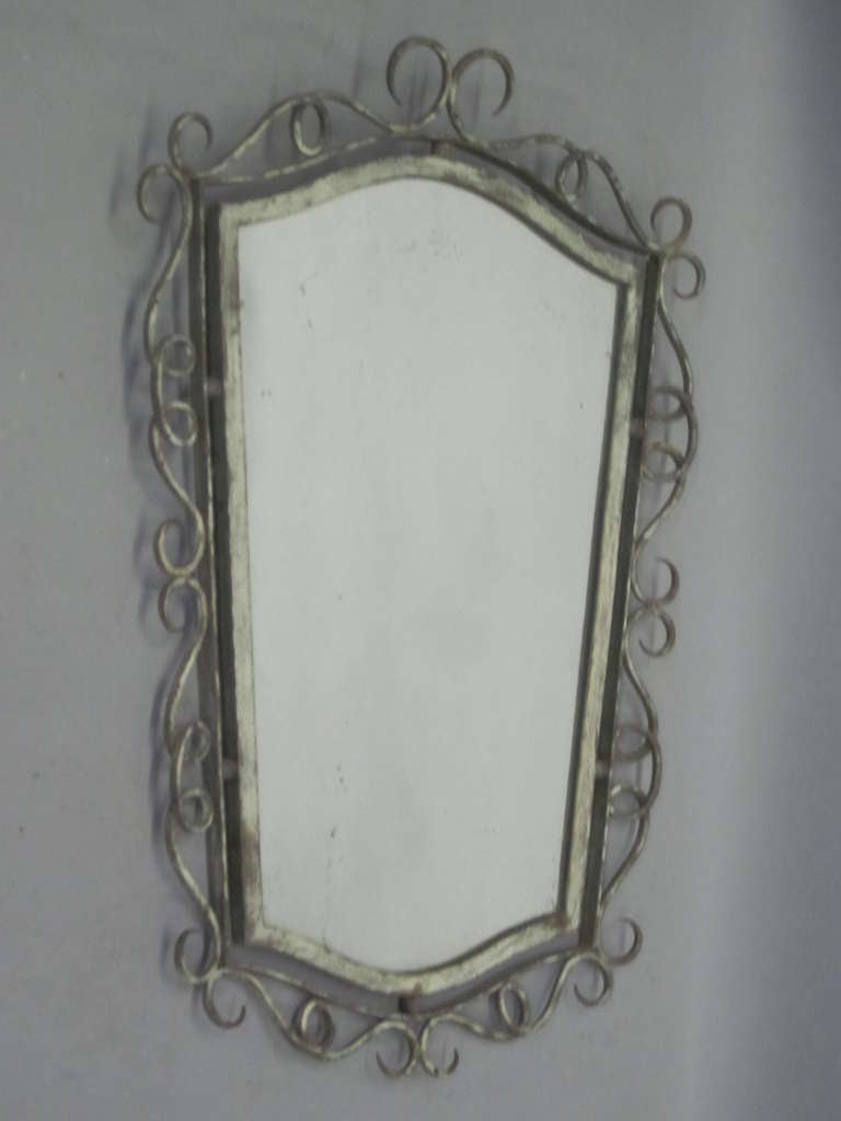 Elegant, handmade, French Mid-Century / Neo-Baroque wrought iron mirror in a lyrical and poetic form with a distressed grey patina, attributed to René Drouet.