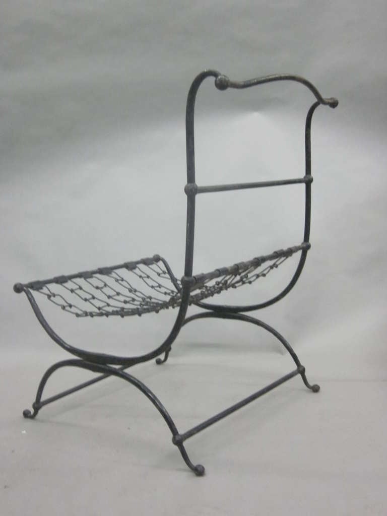 Wrought Iron Rare Pair of French Hammered Iron and Chain Lounge Chairs by Jean-Charles Moreux For Sale