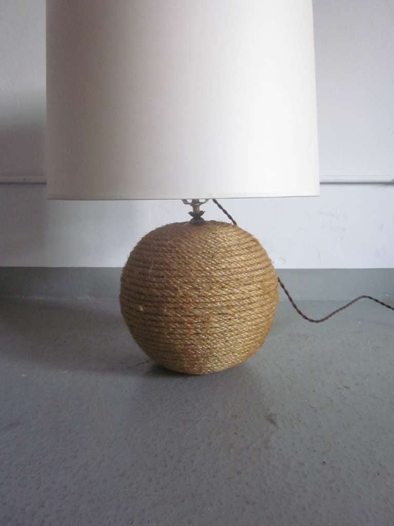 Sublime Pair of French Mid-CenturyTable Lamps in the Form of a Perfect Sphere and Covered in Rope by Adrien Audoux and Frida Minet. The pieces convey a modern rustic / brutalist sensibility. 

Shades are for demonstration purposes only.
