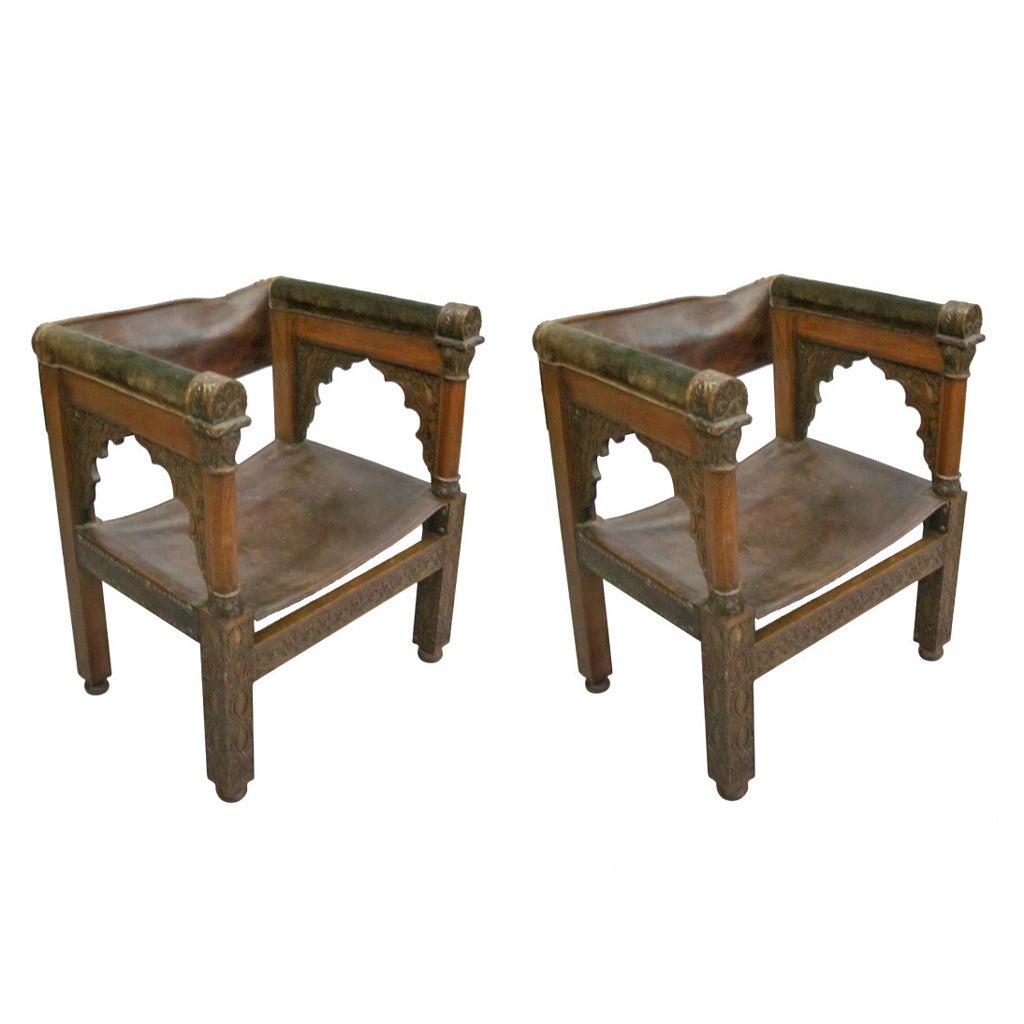 Four Franco-Islamic Carved Wood and Leather Lounge Chairs