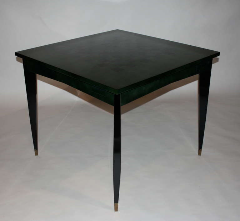 Two-tone emerald/black beka lacquer game table designed by Raphael, beautiful legs with bronze sabots. The top is illustrated with a checkered pattern. Each corner is designed with a drawer and ashtray.