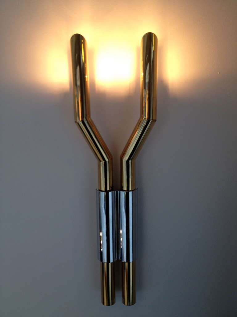 Beautiful pair of sconces finished in brass and chrome.