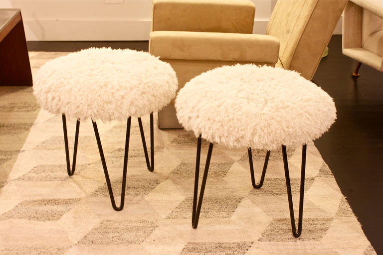 Black painted iron stools from the 1950s. They are re-upholstered with faux Mongolian wool.