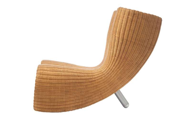 A chair of wicker, brushed aluminum, and steel. Designed by Marc Newson (b. 1963) and manufactured by Idée, Japan.