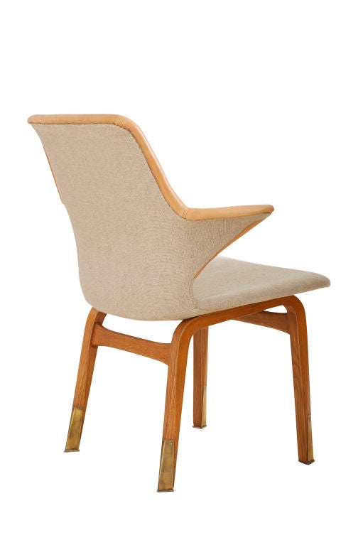 A set of four “lulu” chairs realized for the Marski Hotel, Helsinki of linen upholstery, leather, oak and brass.  Produced by the Asko Furniture Group and designed by Ilmari Tapiovaara (1914 - 1999).