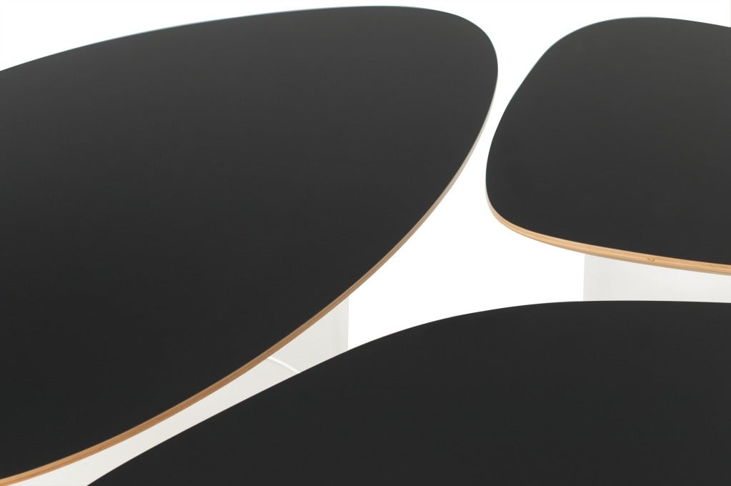 A set of tables (black or white laminate), beech plywood and base of pmma (polymethyl methacrylate) designed by Janette Laverrière (b. 1909). signed and numbered. From the limited edition of 25. 

H 13.8” x W/L 53” x D 27.5”
H 13.8” x W/L 43” x D