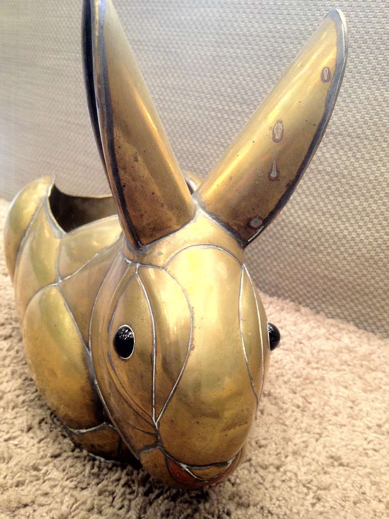 Mixed metal (brass and copper) bunny rabbit with black glass eyes and a recess suitable for greenery.