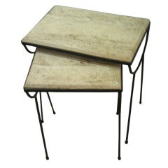 set of two travertine and iron nesting tables