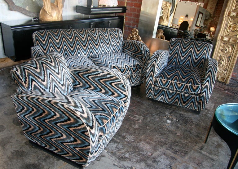 Comfy club chairs with a settee to match in a vintage Missoni looking fabric.