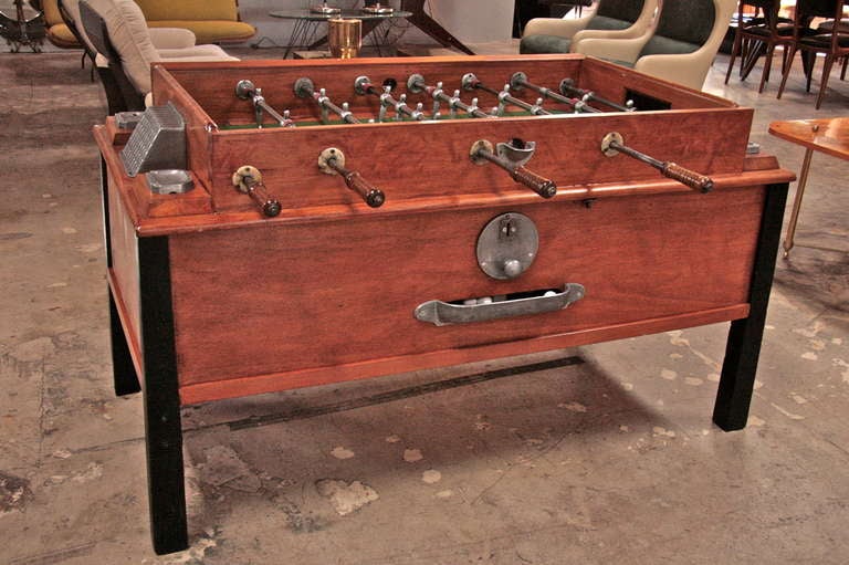 vintage foosball table with ashtrays