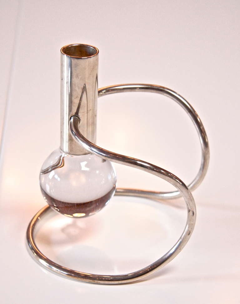Whimsically designed candle holder in silver.
By Sabatini
