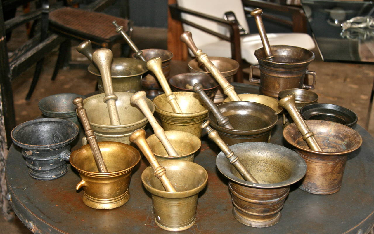 Heavy Italian brass, bronze and cast iron mortars; some with and some without the pestle -- a stunning collection for any kitchen!