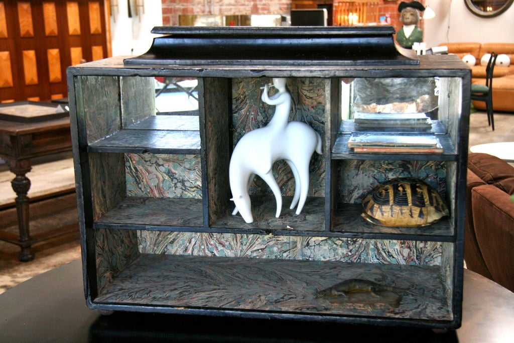 Hidden drawers and more with this fabulous curio cabinet.