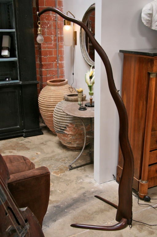 Imagine with a modern shade OR no shade at all and there you have it. The wood does all the work in this unusual 50s fine fixture.