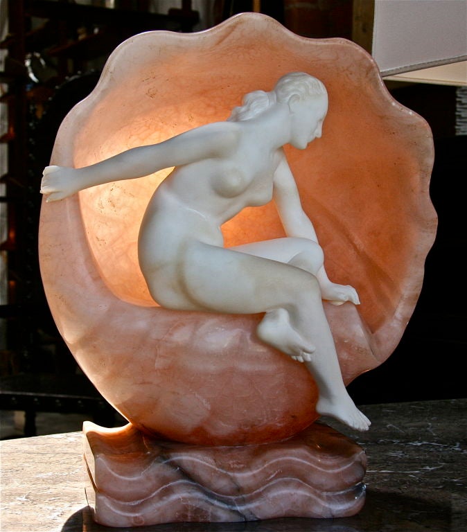 Italian marble carved woman perched on a shell. Che dettagli!!!

Beautifully detailed piece.