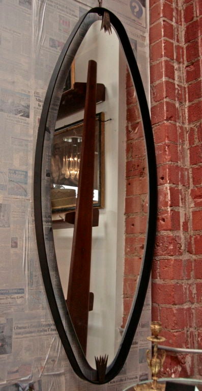 Ma+39's oversized iron, brass oval mirror.