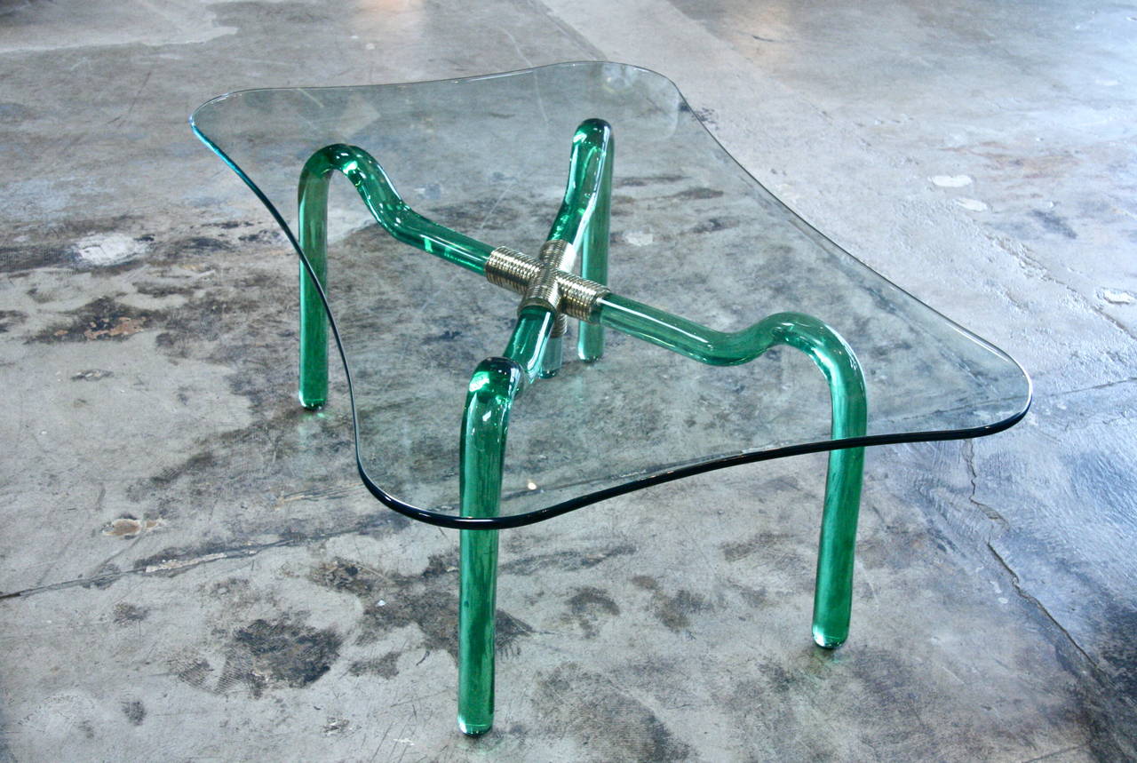 Coffee table in green glass. Brass details.
Top in glass. Gorgeous green glass base. They don't make'm like this anymore...