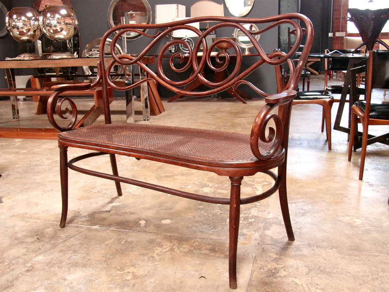 Charming  bentwood Thonet bench with caned seat. Found in Northern Italy. Can't you just see it in your breakfast nook while sipping your 1st or 2nd or 3rd espresso?