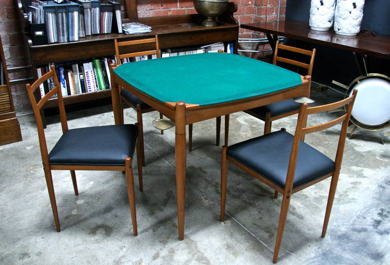 Italian 60's Gio Ponti Reversible Walnut/Felt Poker Game Table ( CHAIRS NOT INCLUDED!).
Brass sliding plates accent the corners for cockails, snacks or ashtrays for the die hards out there..., so double down and buy it!