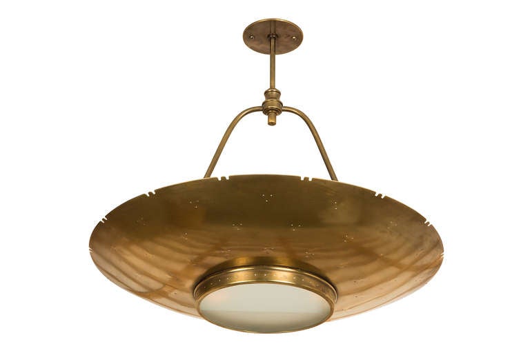 A perforated brass saucer with frosted glass downlight gives a warm sensual 
glow to a table or room.