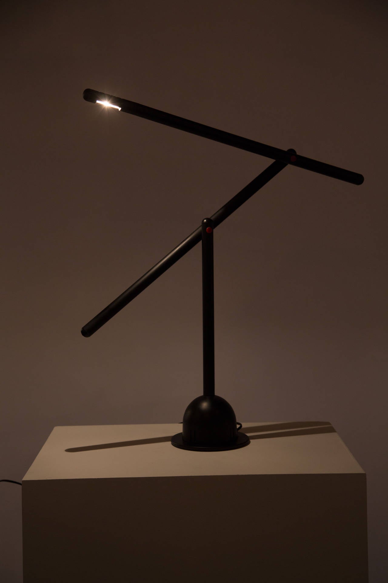An articulating black matte table lamp.
