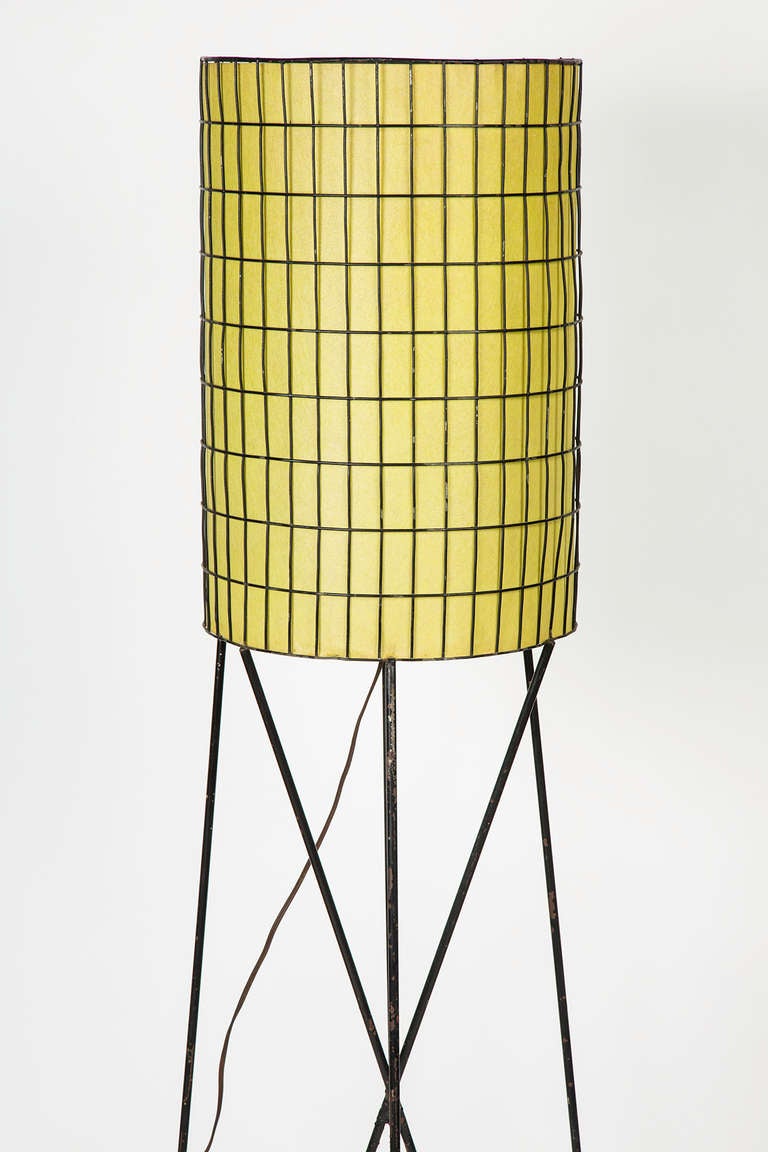 Metal and wire floor lamp with original shade.