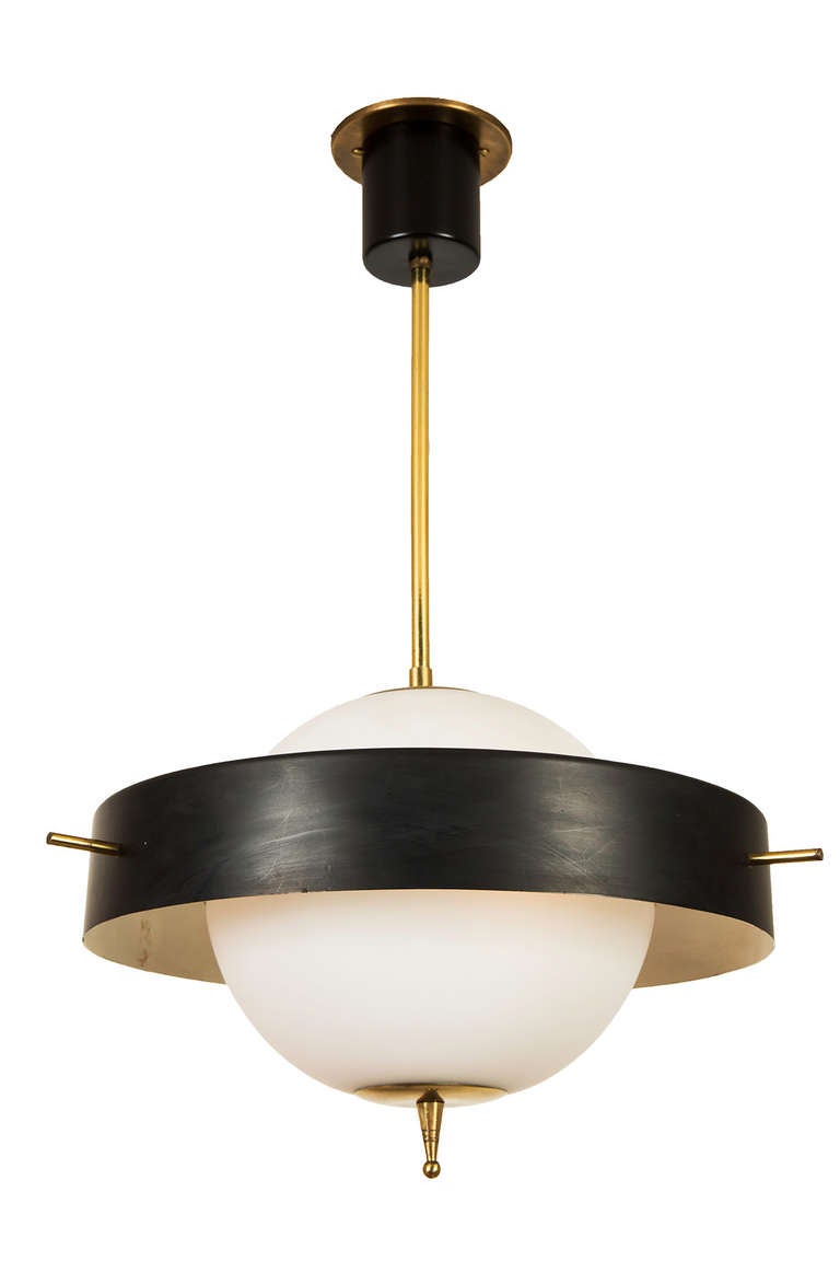 A Satin Glass Globe Encircled with Black Shade Suspended 
with Brass