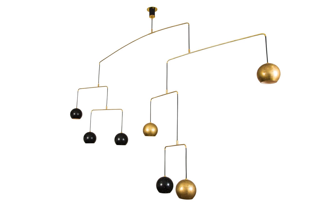 Custom mobile chandelier, suspended from the ceiling,
 individual tiers retain the capacity of motion.
