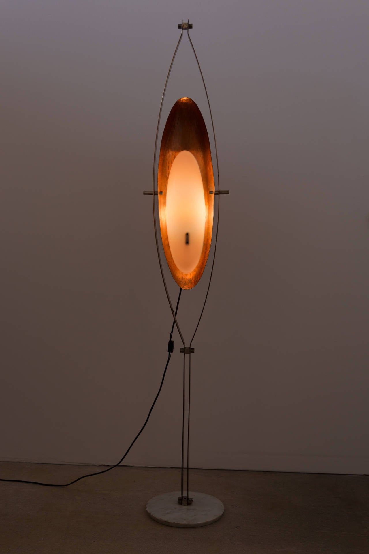 Floor lamp with marble base, copper, plexiglass shade and hammered brass frame.