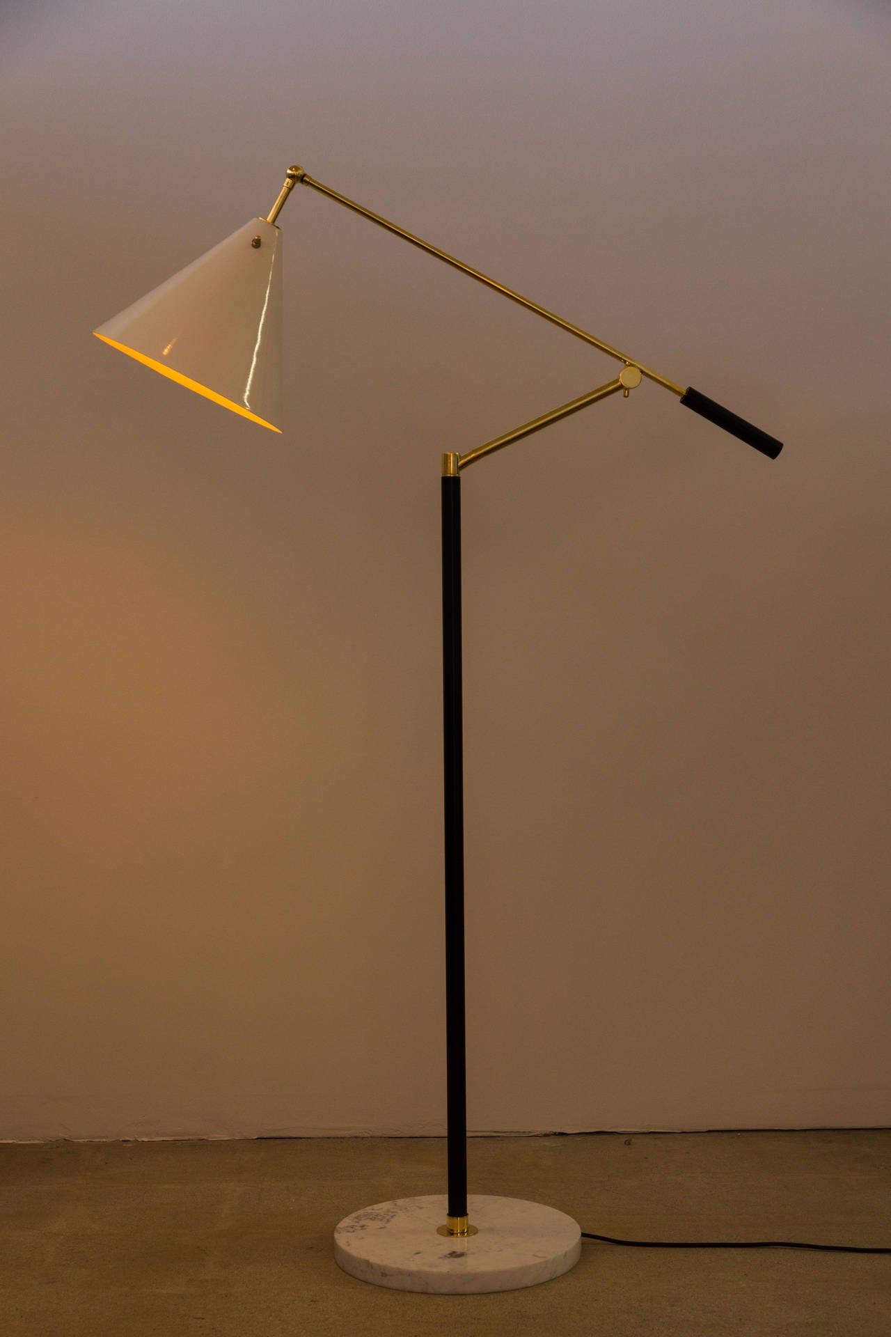 Floor lamp with adjustable arm and shade, marked Made in Italy.