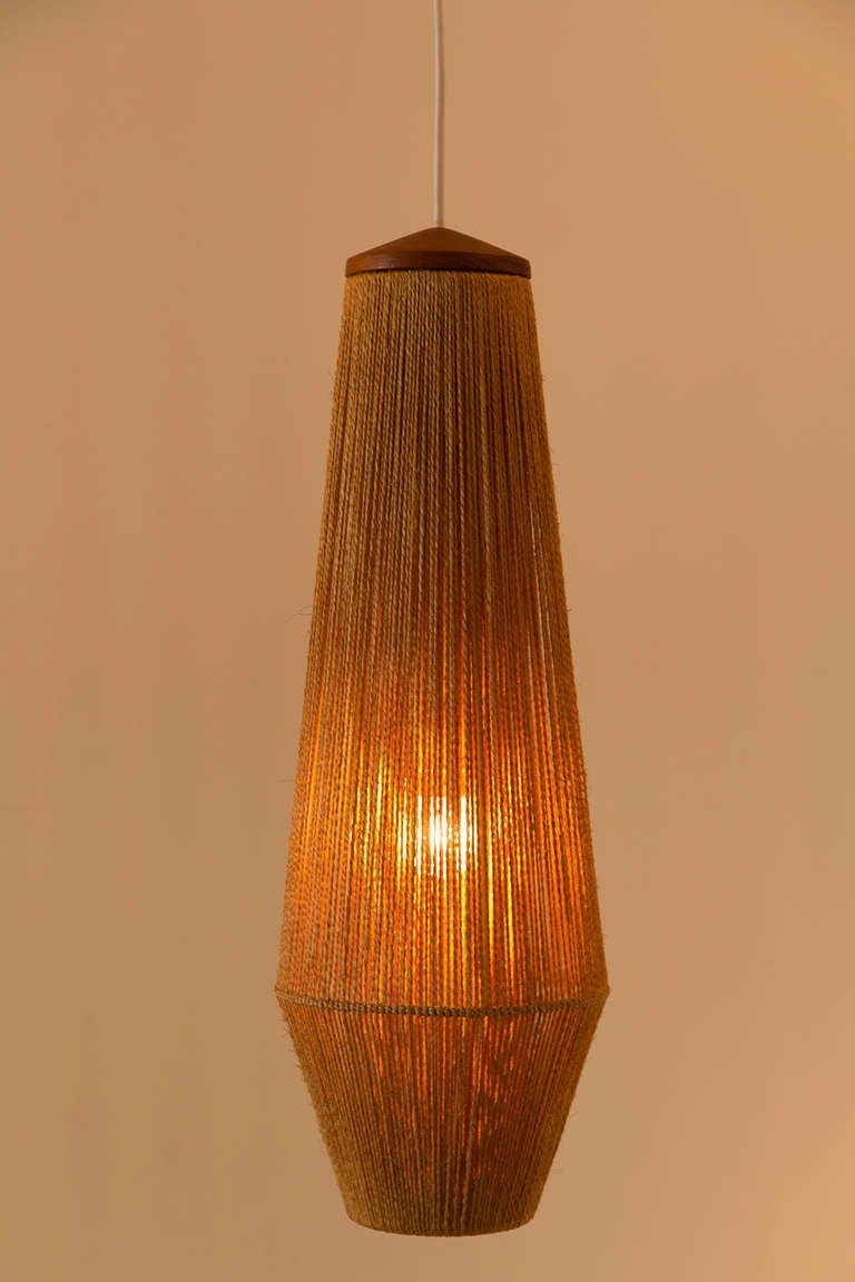 Teak and jute wrapped pendant light designed by Fog & Mørup in Denmark, circa 1960s. Wired for US junction boxes. Takes one E27 75w maximum bulb.