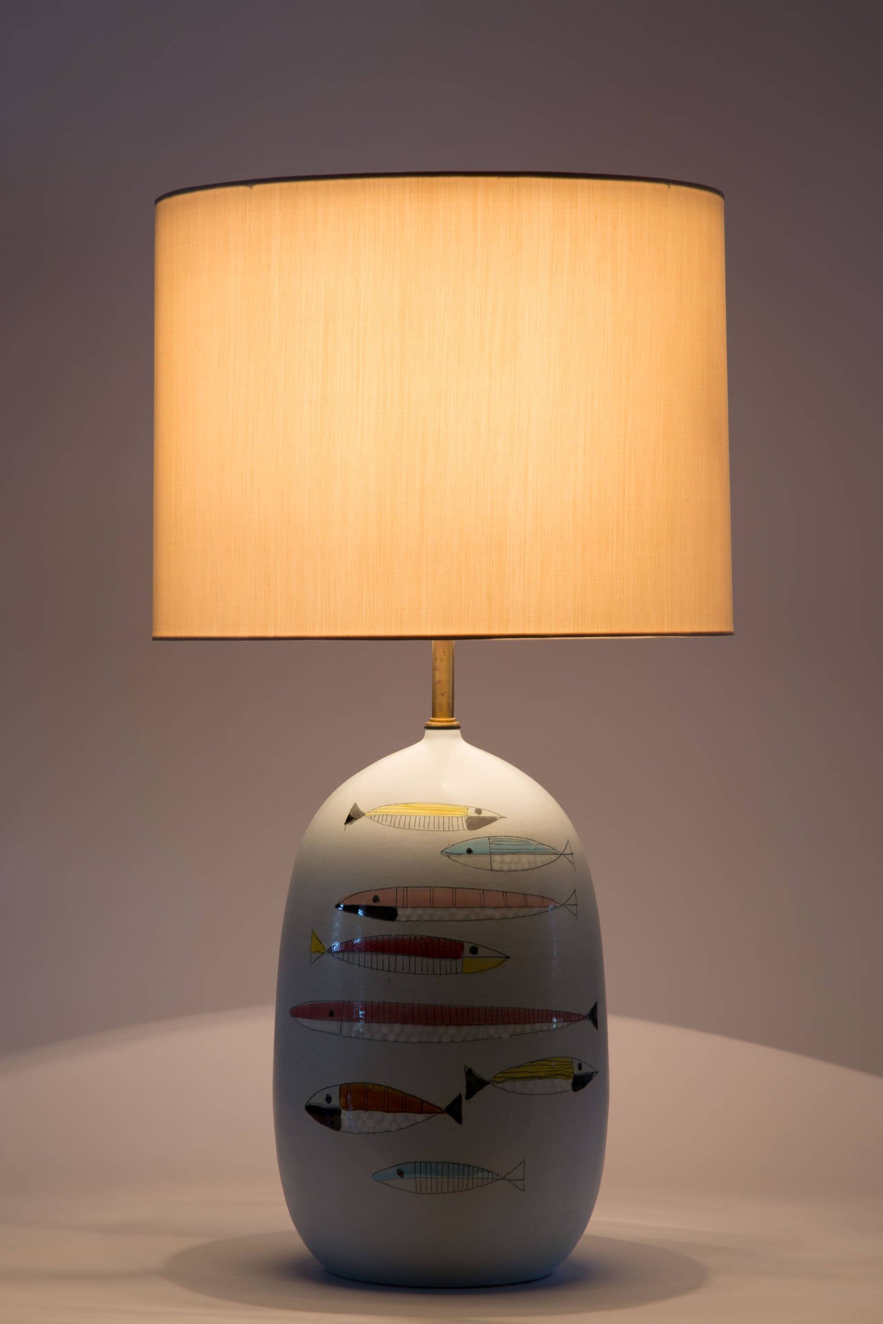 Rare hand thrown, ceramic table lamps designed by Raymor in Italy, circa 1950s. Shade not included. Custom shade fabrication available. Takes one E27 100w maximum bulb.