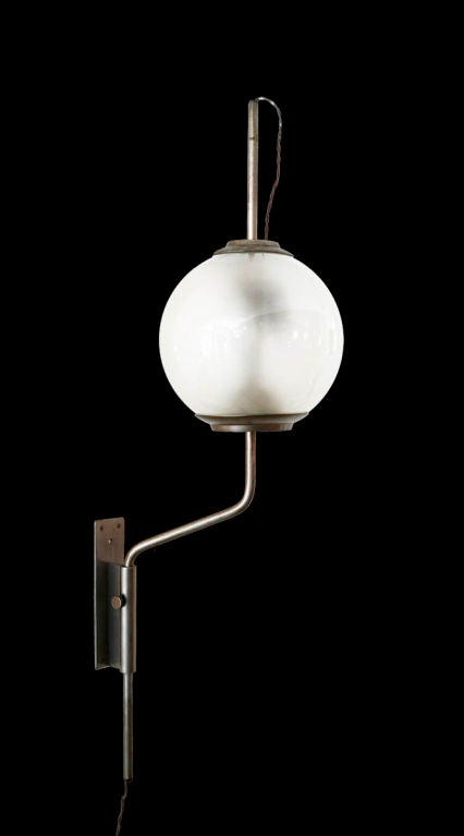 Pallone wall lamp by Luigi Caccia Dominioni for Azucena wall-mounted lamp with vertical positioning that pivots left/right. Brushed nickel and glass. Wired for US junction boxes. Takes one E27 100w maximum bulb