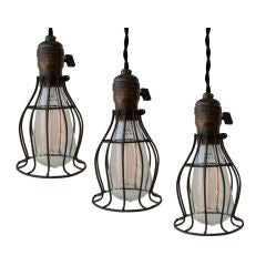 Antique Two Hubbell Industrial Cage Lamps