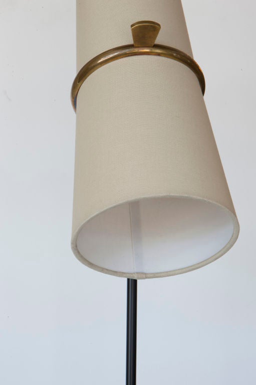 Floor lamp with adjustable linen or silk shade provides direct light. Double socket, one in top and one in bottom of shade. Each socket takes one E26 75w maximum bulb. Measurement is for height of lamp and diameter of shade. Contact us for