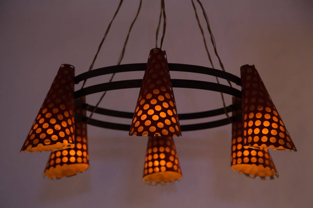 Six-shade chandelier with perforated metal and paper shades designed by Disderot in Italy circa 1950s. Wired for US junction boxes. Each shades takes one E27 40w maximum bulb