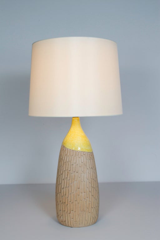 Rare pair of ceramic earthenware table lamps designed by Raymor in Italy, circa 1950s. Rewired. Custom silk shades. Original cord. Each lamp takes one E27 100w maximum bulb.