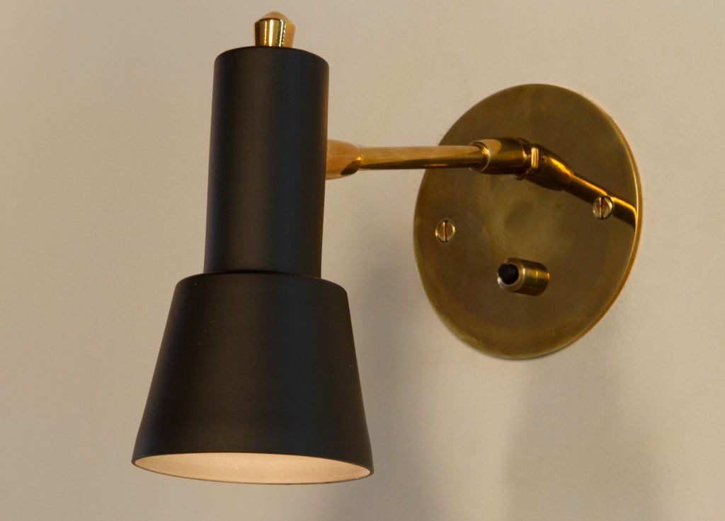 Pair of petite Italian sconces, each with original ball pivot at back plate and at hood for multiple positioning. Custom backplates wired for US junction boxes. Painted metal and brass. Each sconce takes one E27 75w maximum bulb.