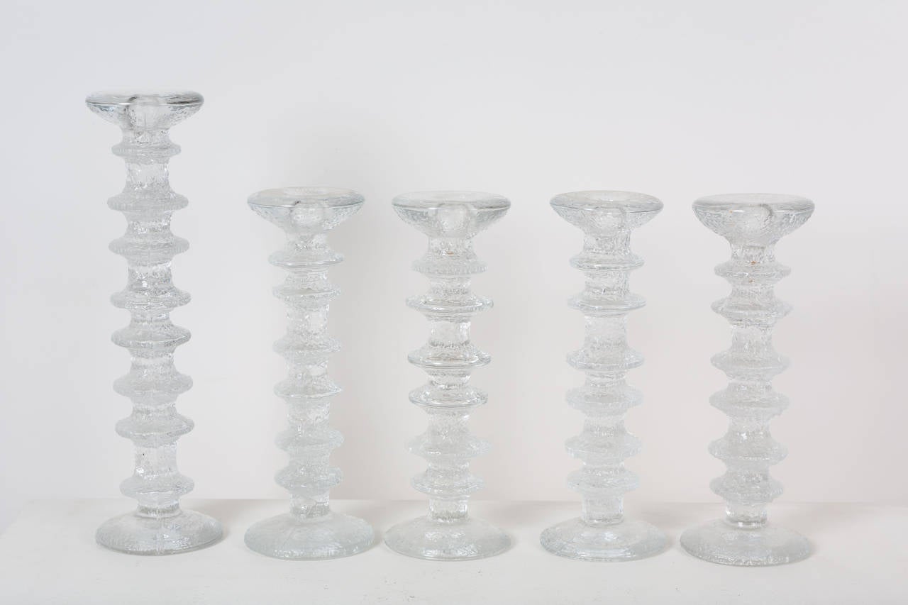 Collection of 16 glass candlesticks designed for Iittala, retain original labels.