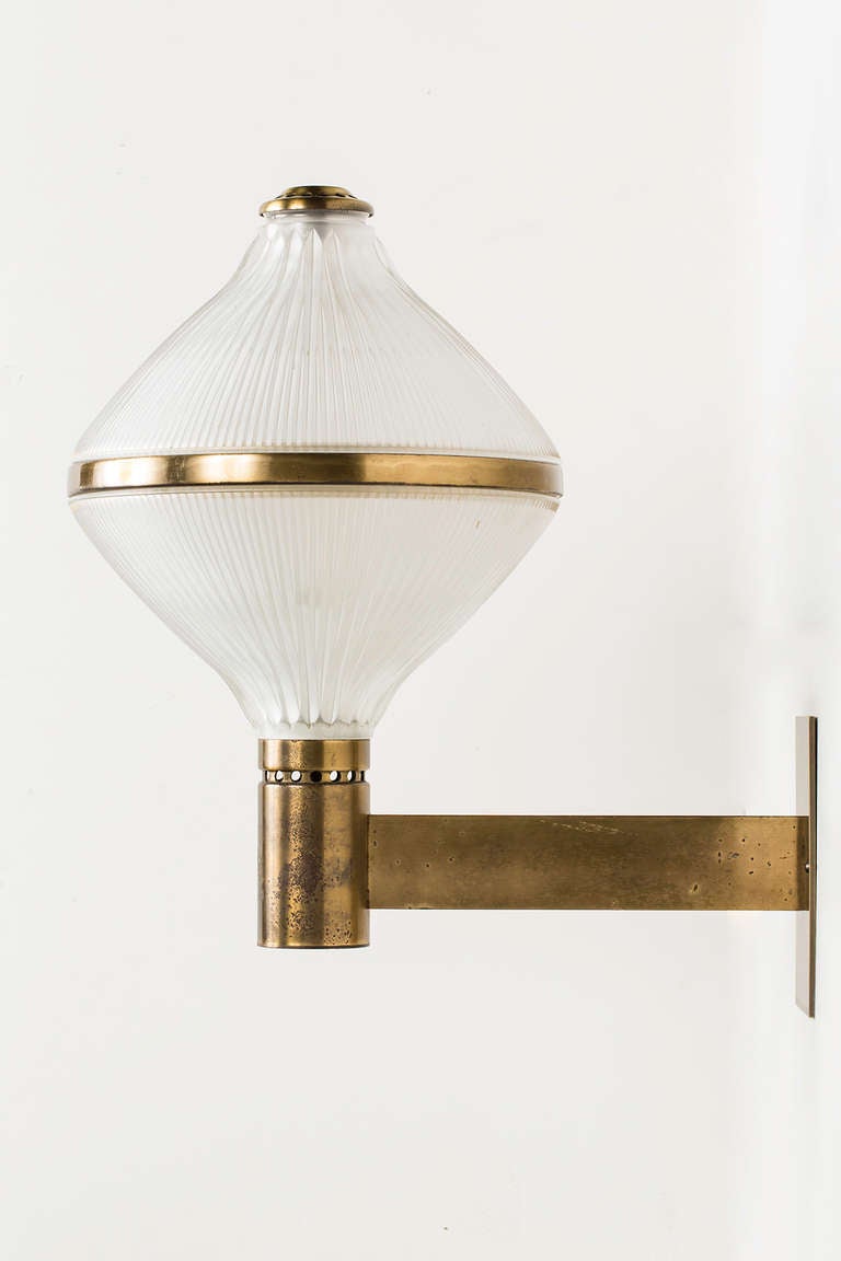 Brass and holophane sconces.