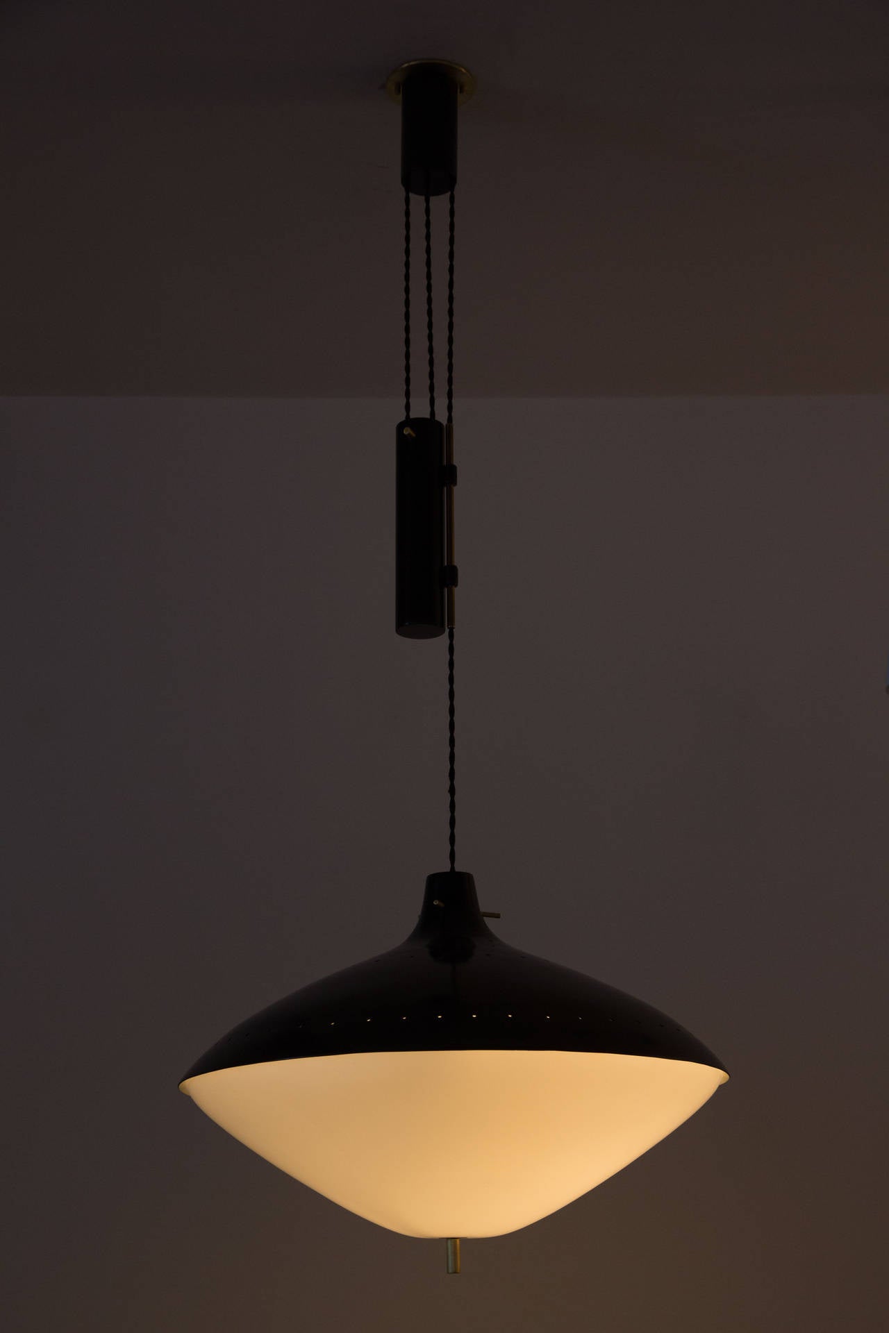 Black aluminum and acrylic pendant lamp.