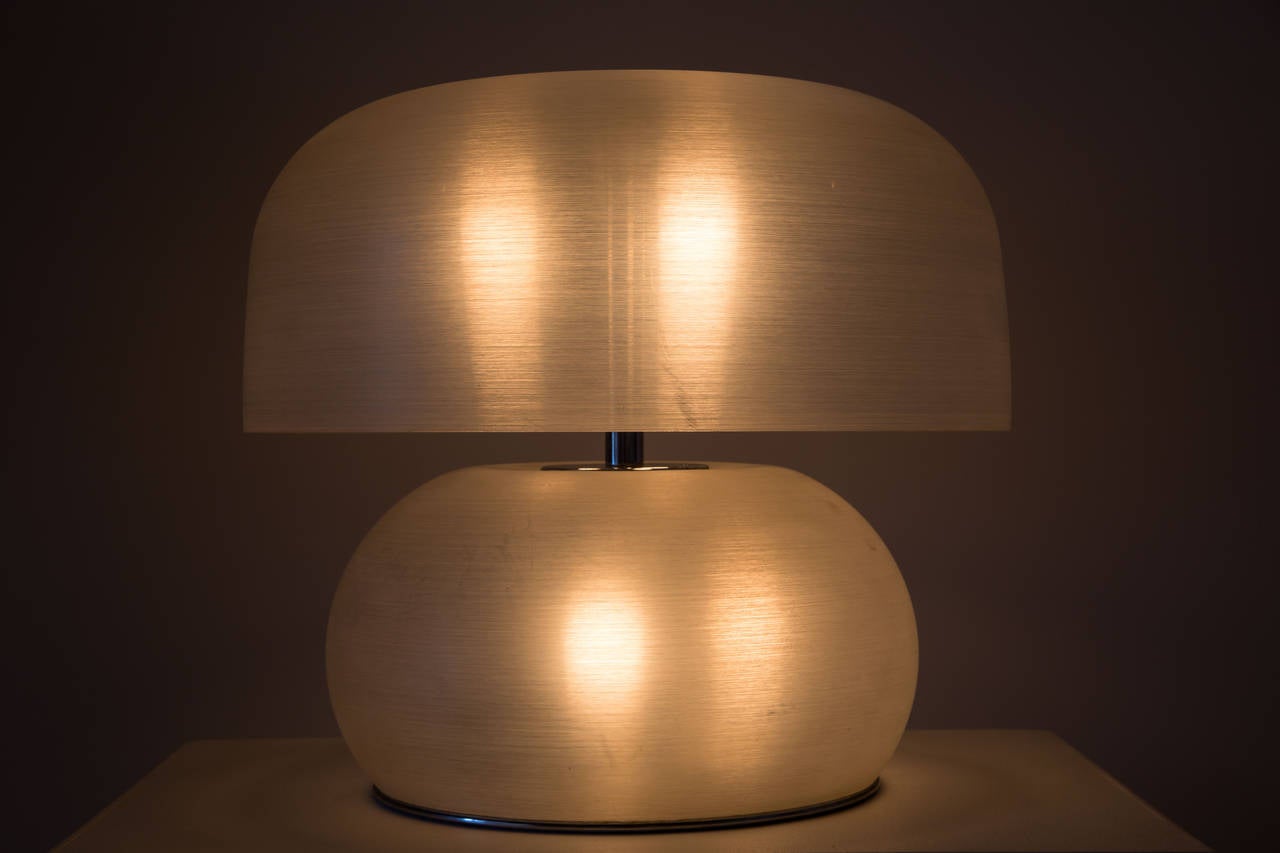 Spun acrylic Italian table lamp from the 1970s.
 Both shade and base are illuminated.