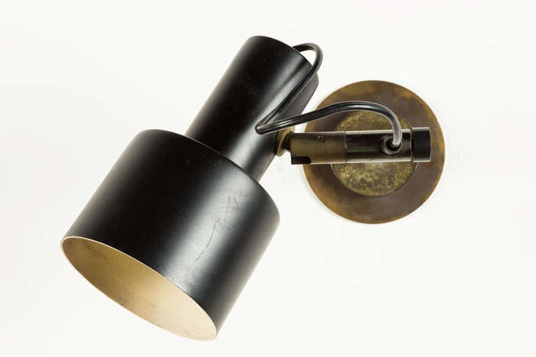 Pair of Tito Agnoli sconces
sconce rotates up and down
and slides back and forth