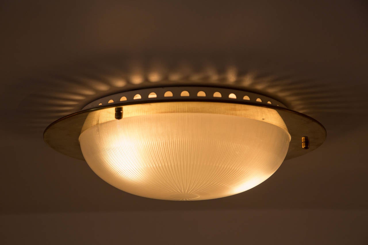 Brass and glass flush mount ceiling/wall lights.