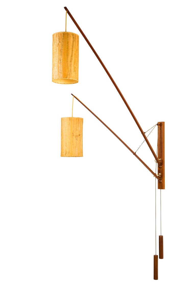 Wall light with articulating arms, counterweights.
Ball joints rotate independently, in all directions, can be lifted and lowered.