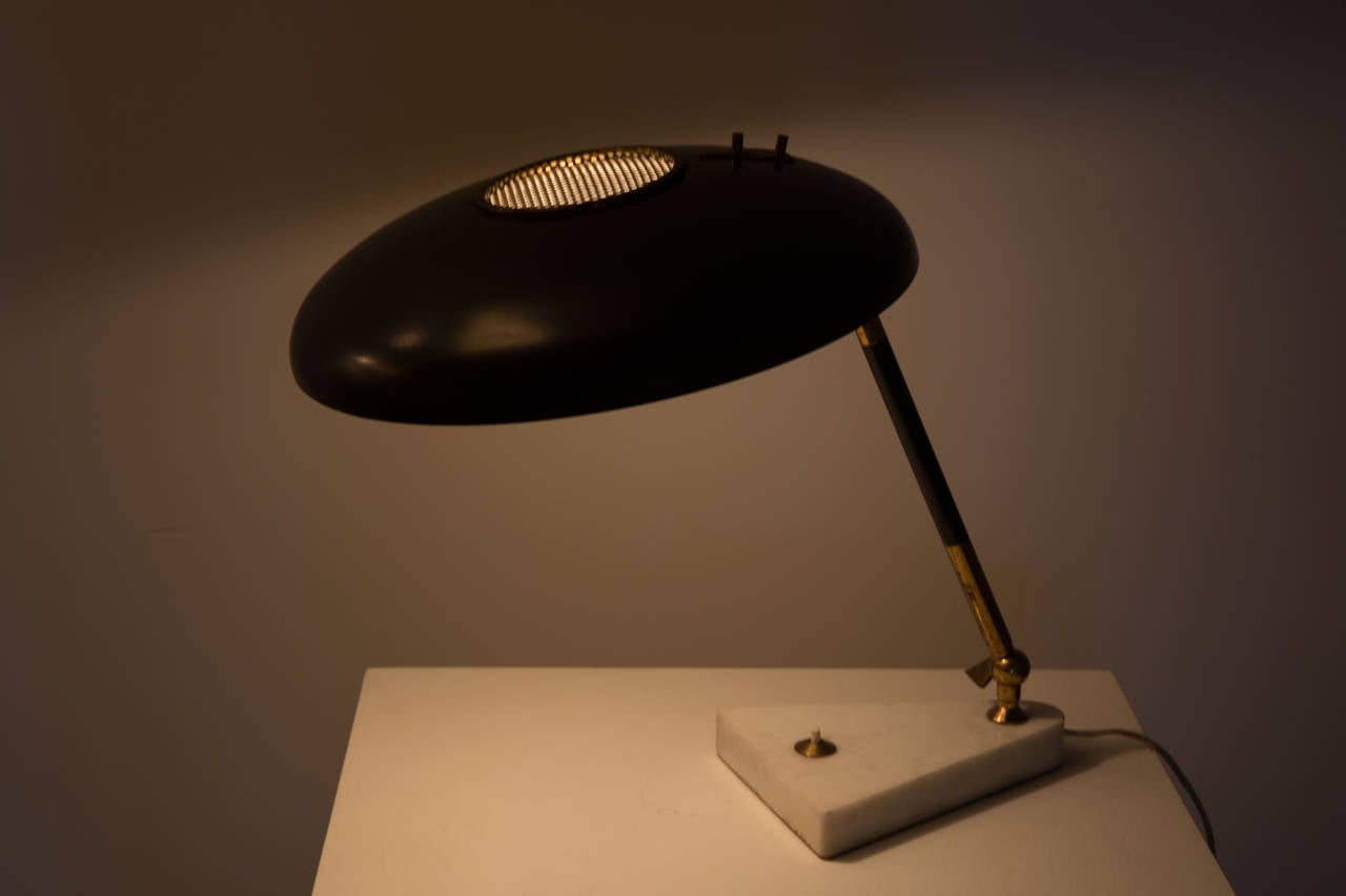 Pivoting table lamp with marble base.