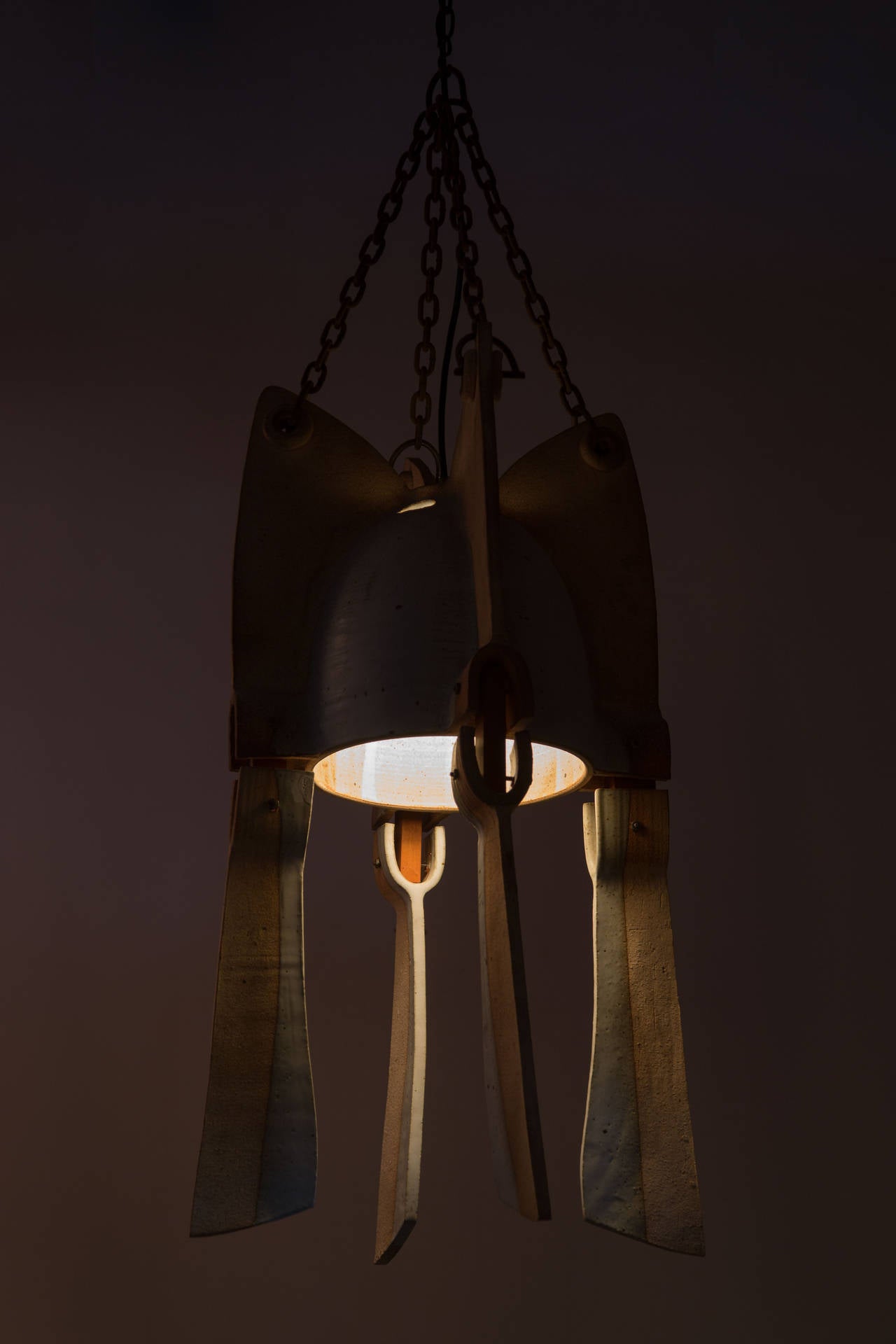 Hand made studio ceramic and wood chandeliers, two sizes. Made for a church in Rochester, New York in the 1960's by James and Philip Secrest. Four large, three small.