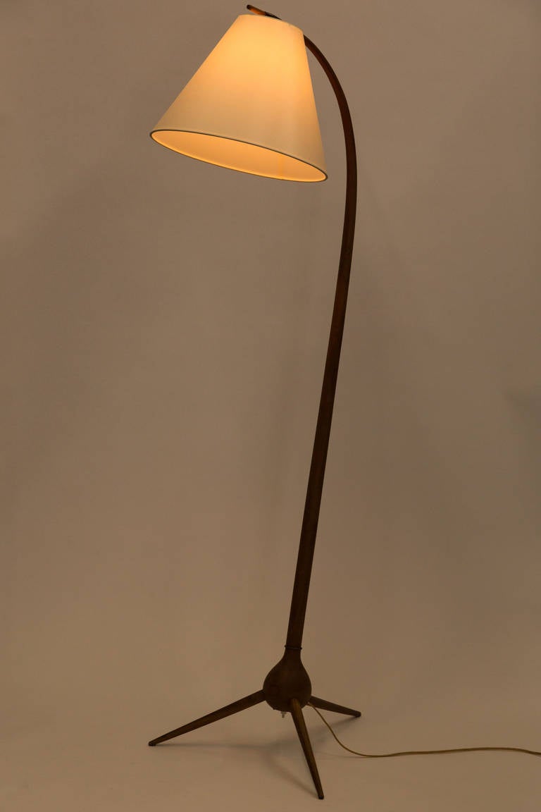 Floor lamp molded from stained
beech, linen shade