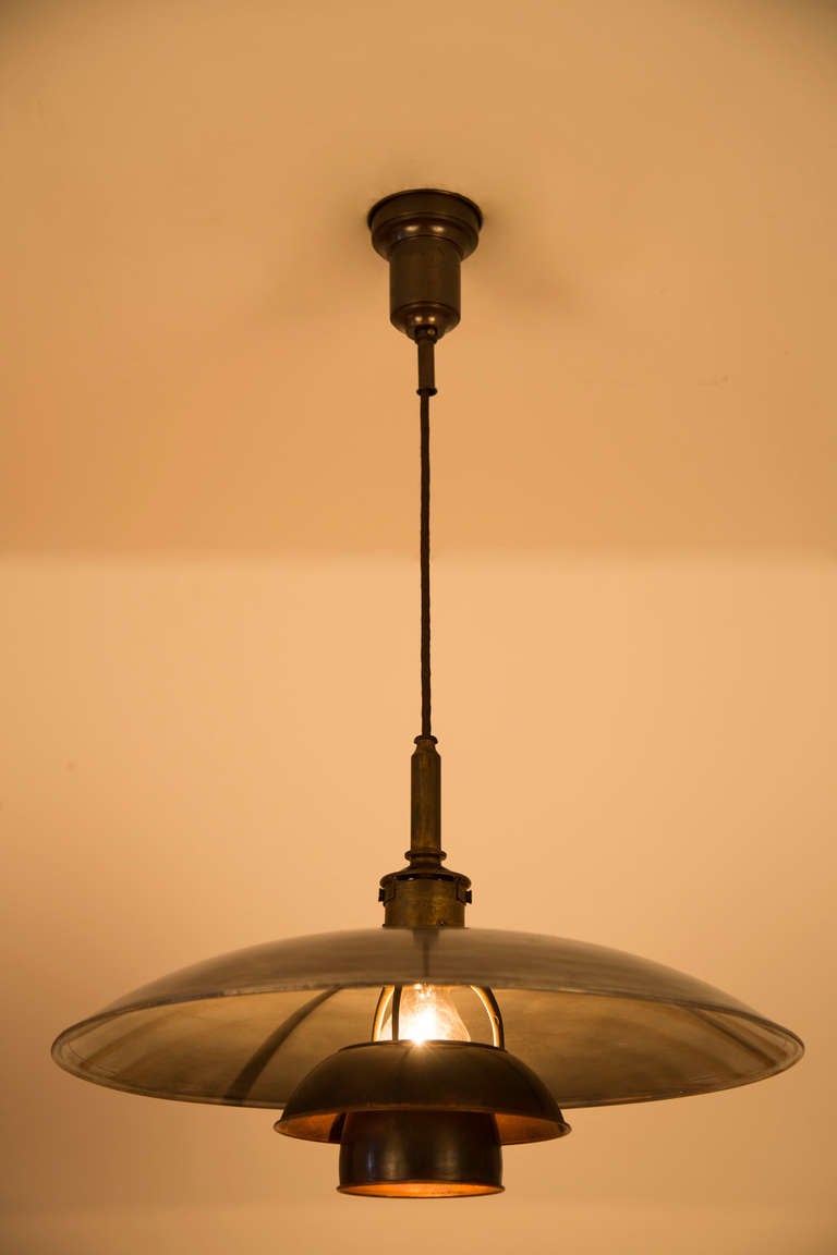 An unusual 1920's PH Lamp. Bronze, Aluminum and copper
combined to form one of the original Poul Hennigsen Lights.